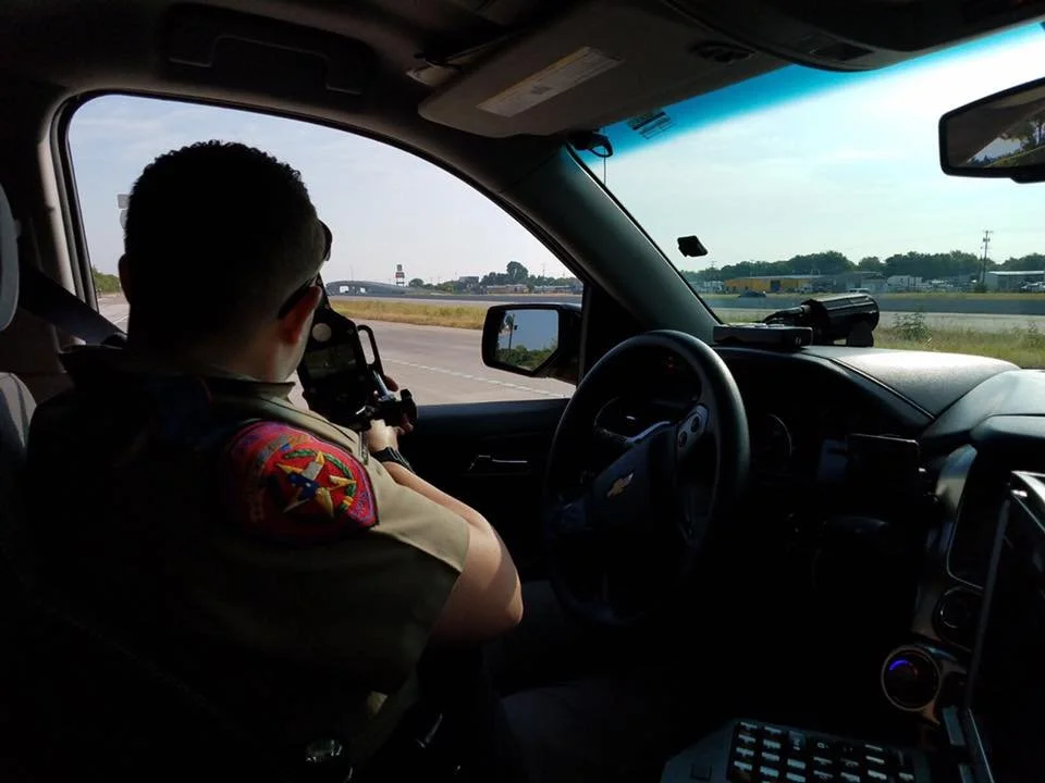 Tania on patrol in a law enforcement vehicle