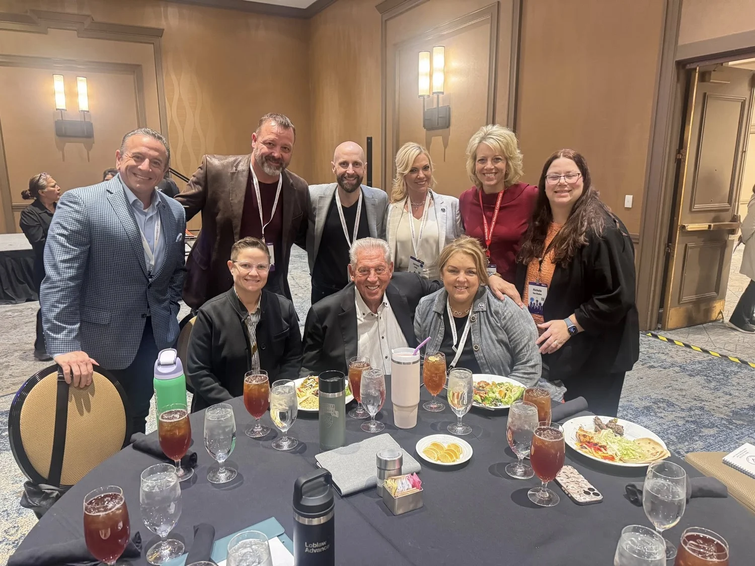 Tania with colleagues at a professional event